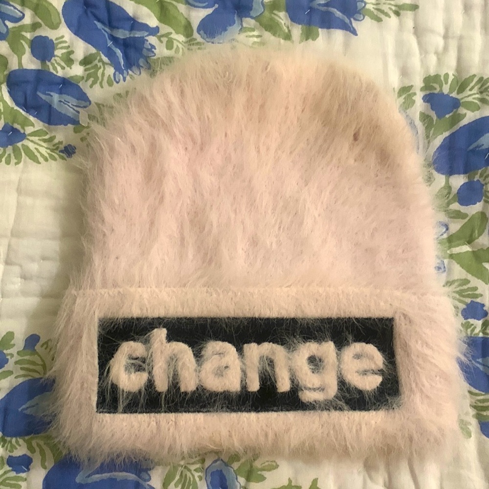 NWOT Extremely soft, pale pink fuzzy yarn cuff cap with CHANGE appliqué on cuff